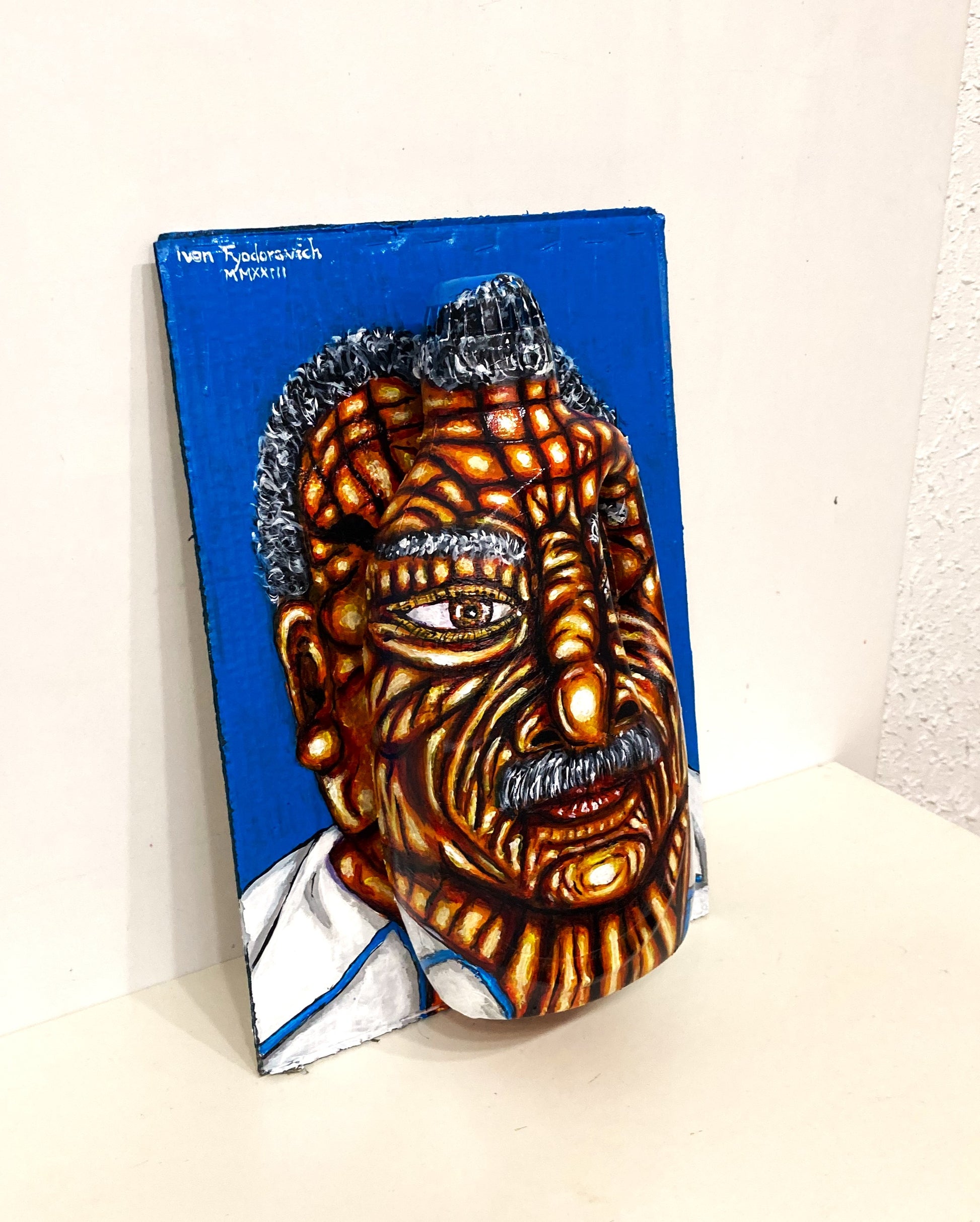 3D Portrait of an Old Man from Costa Rica. Acrylic Painting on Cardboard and Recycled Washing Liquid Plastic Bottle. Medium lateral right view