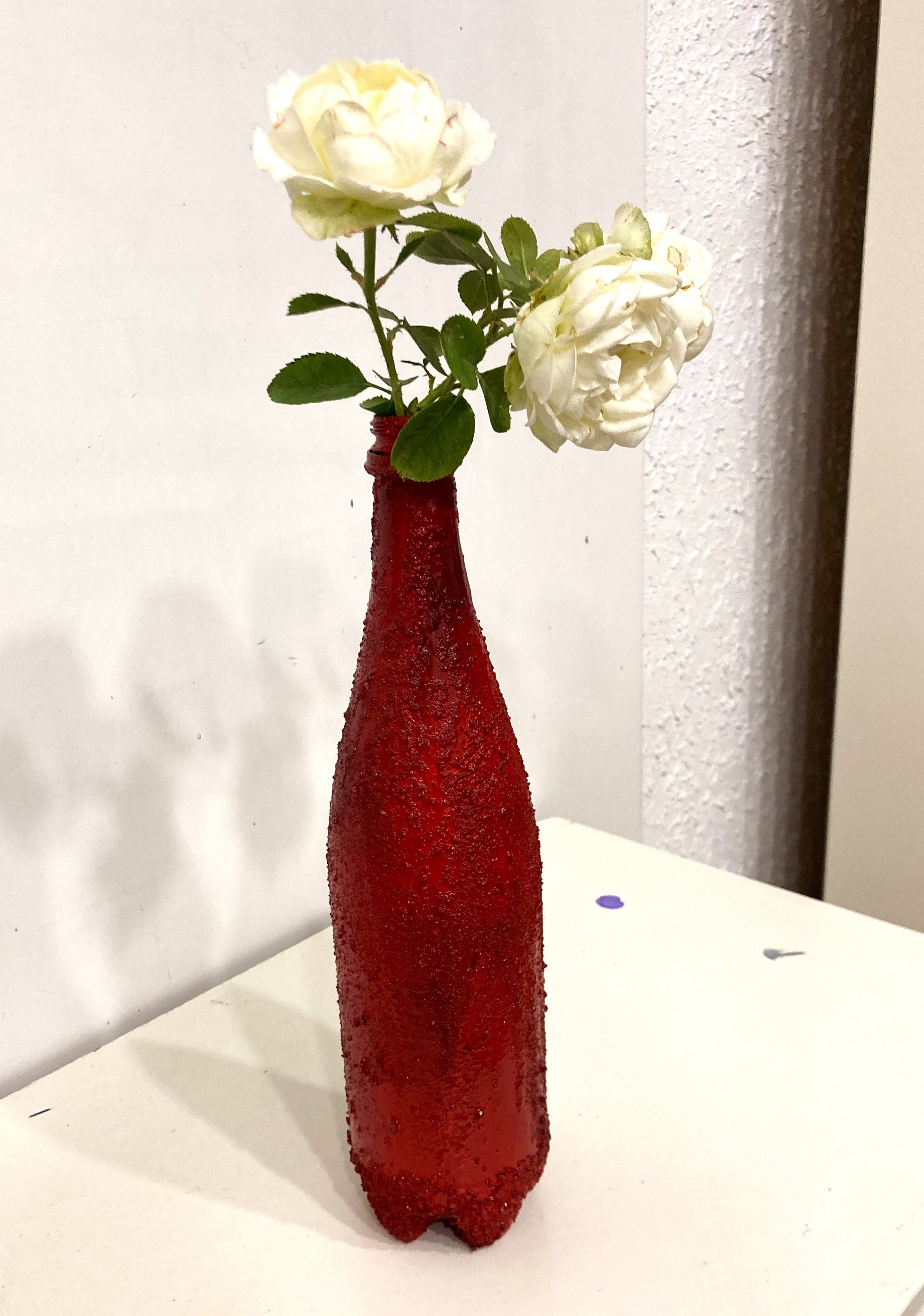 Recycled plastic bottle vase , Acrylic Painted , Sand sprinkled Red Vase for dried flowers. [Recycled Art]. Left Lateral view