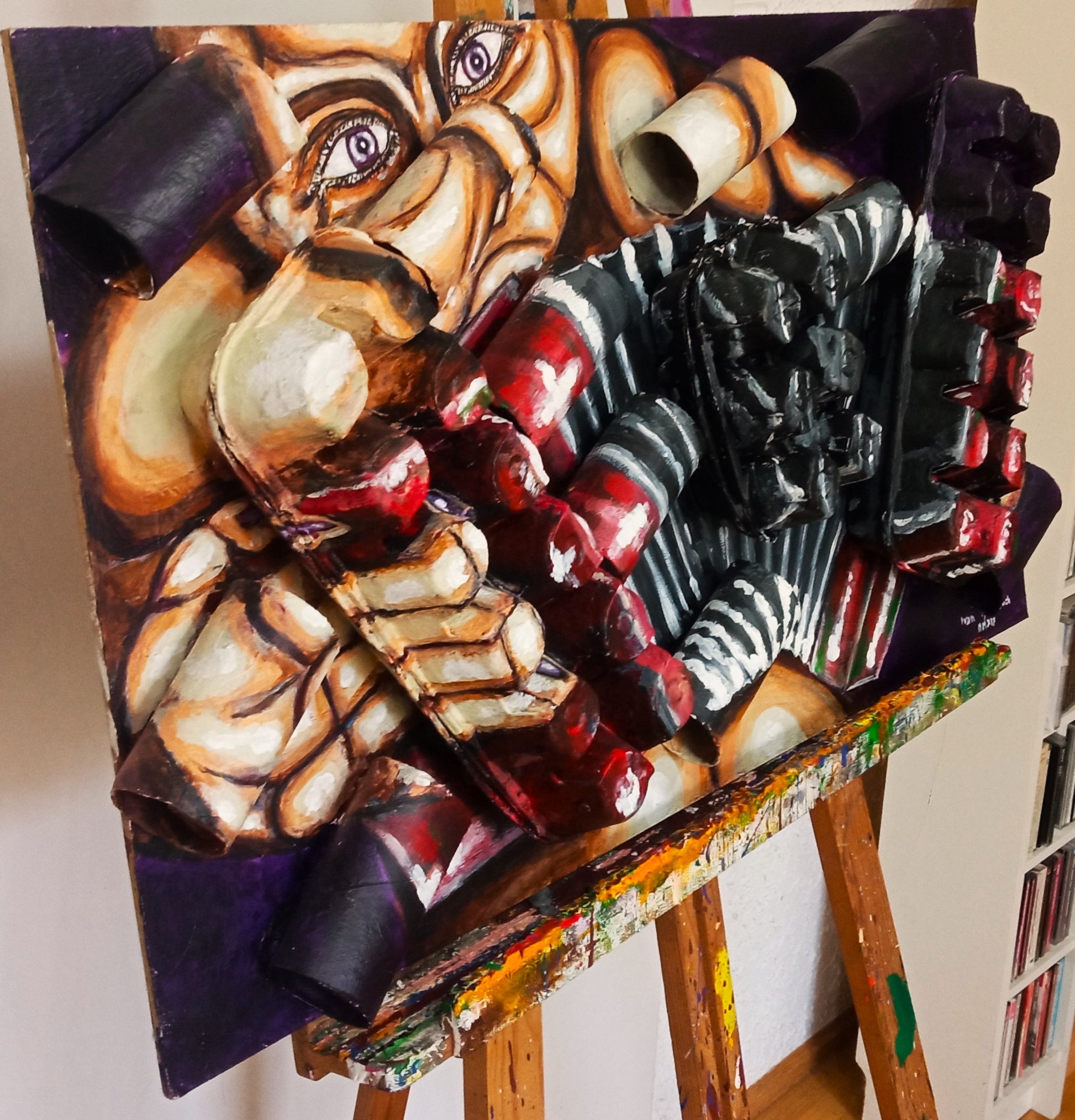 3D art portrait of naked accordionist. Acrylic paint on wood, recycled cardboard tubes and recycled egg cartons."Music painting" [Recycled Art]. Left Lateral View