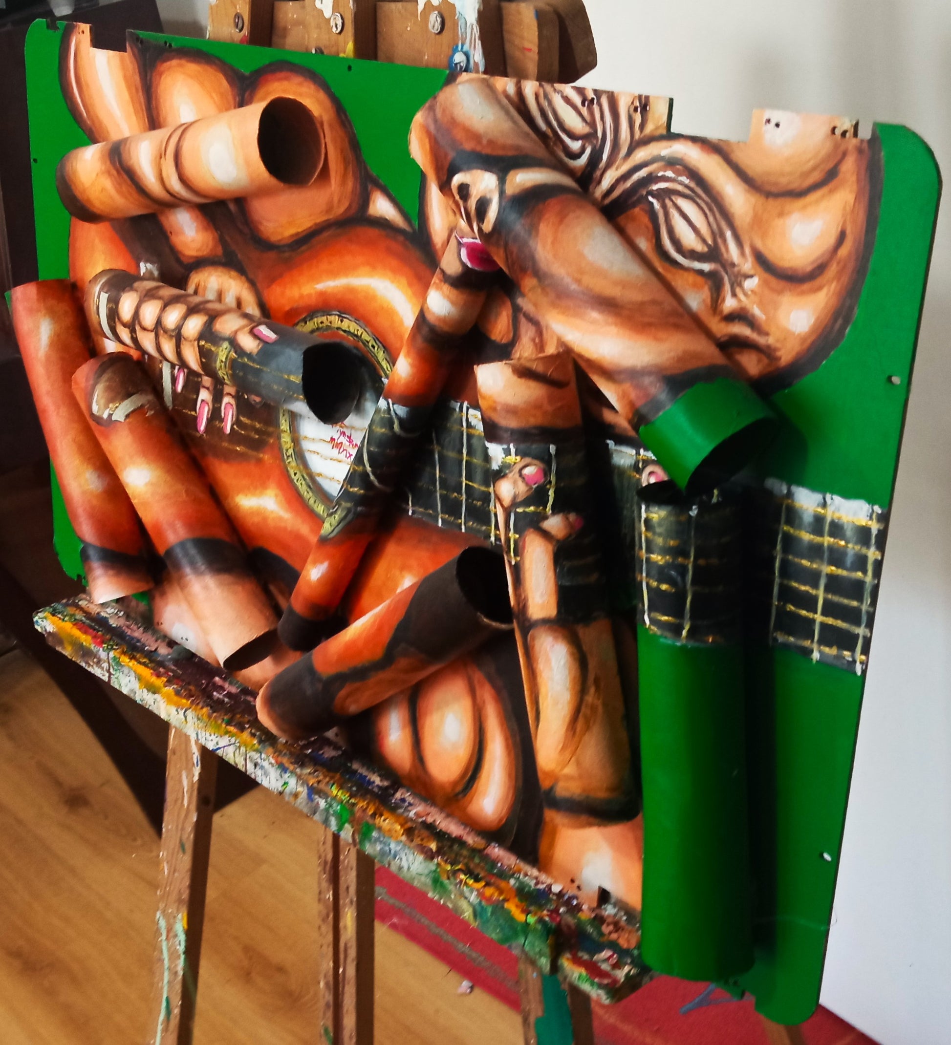  3D art portrait of naked guitarist. Acrylic painting Recycled Materials."Music painting" [Recycled Art]. Ivan Fyodorovich. Right lateral view