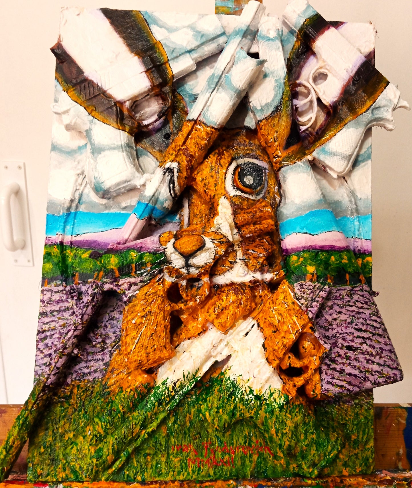 [The Hare Prevails], 3D portrait of a Hare in nature. Acrylic on woodboard and toy guns and pistols (Recycled Art). Front View