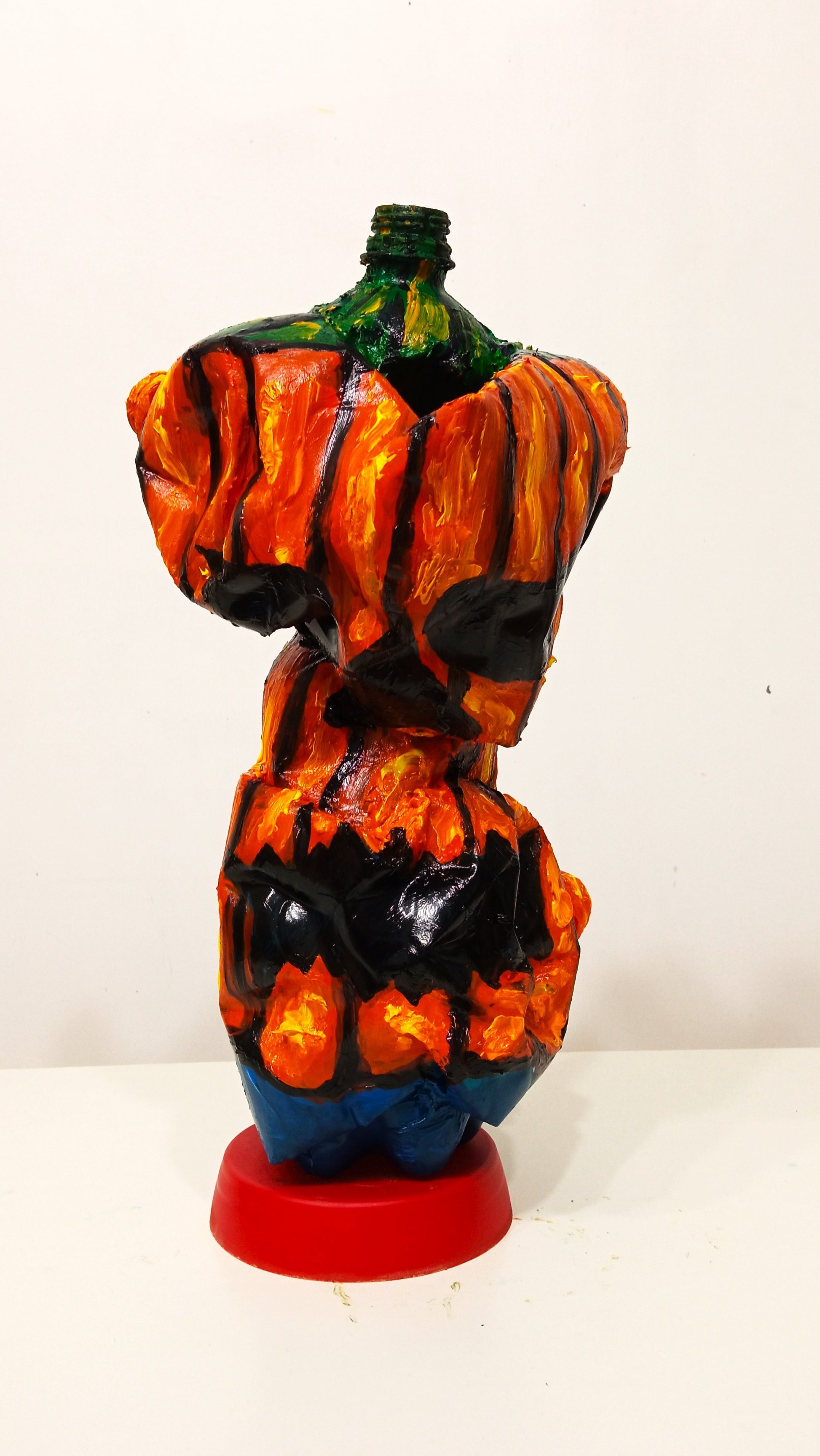 Big Headed Halloween Pumpkin Figurine Created out of Recycled Plastic Bottles . [Recycled Art]. Ivan Fyofdorovich. Front view