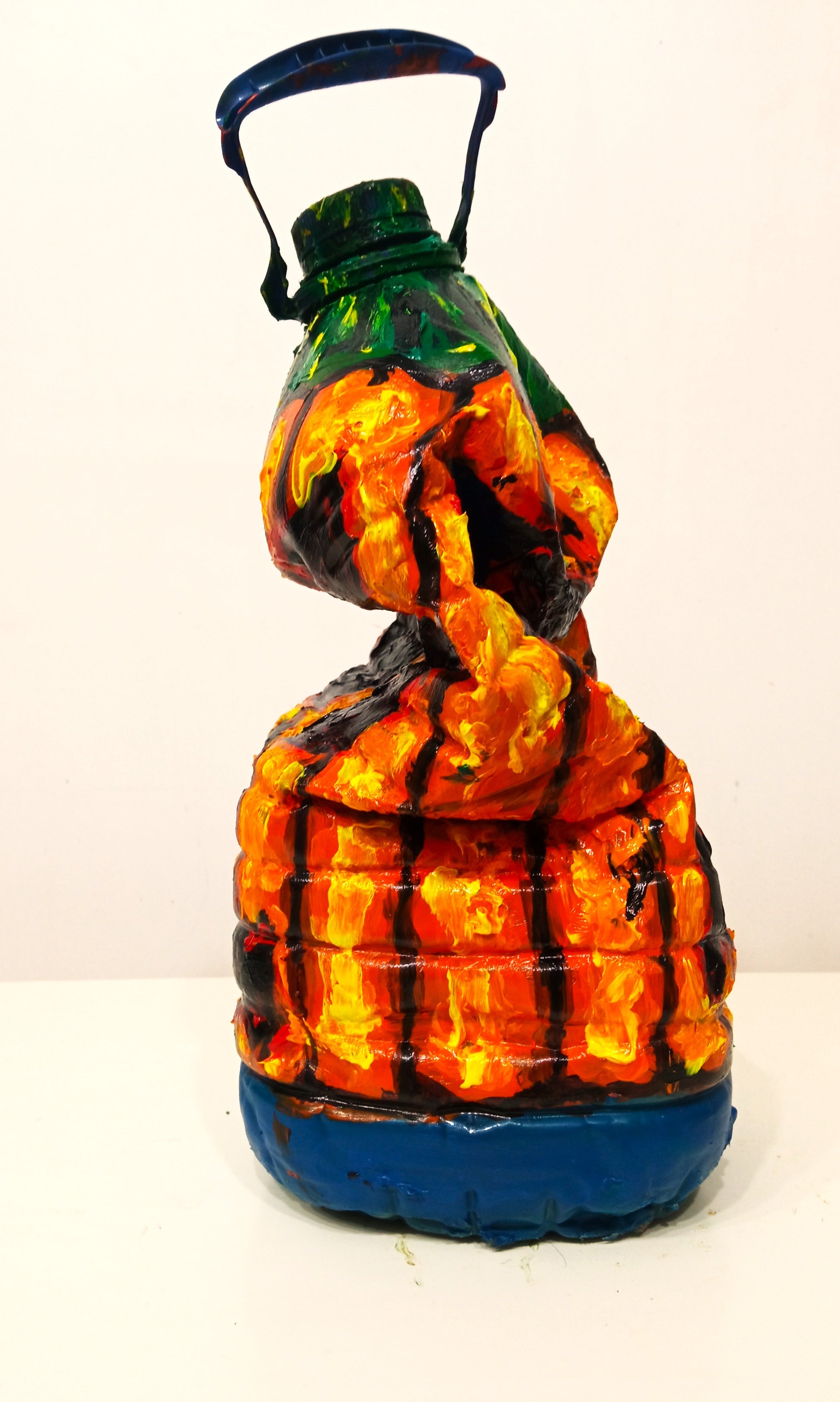 Fat Halloween Pumpkin Figurine Created out of Recycled Plastic Bottles . [Recycled Art]. Ivan Fyodorovich. Left lateral view