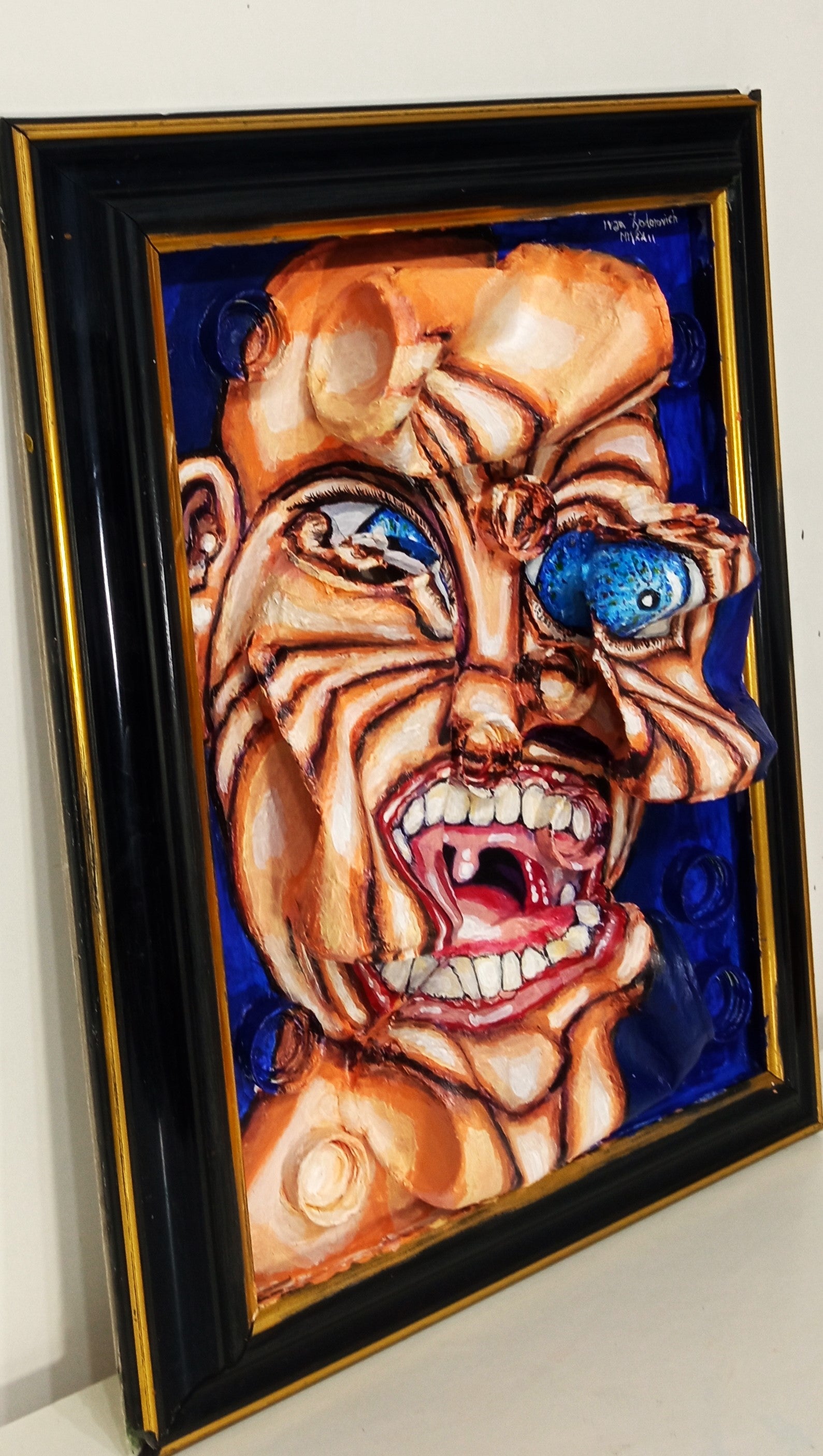 3d art portrait of a naked angry man. Acrylic on recycled woodboard and recycled beer cans and bottle tops. Medium Left View