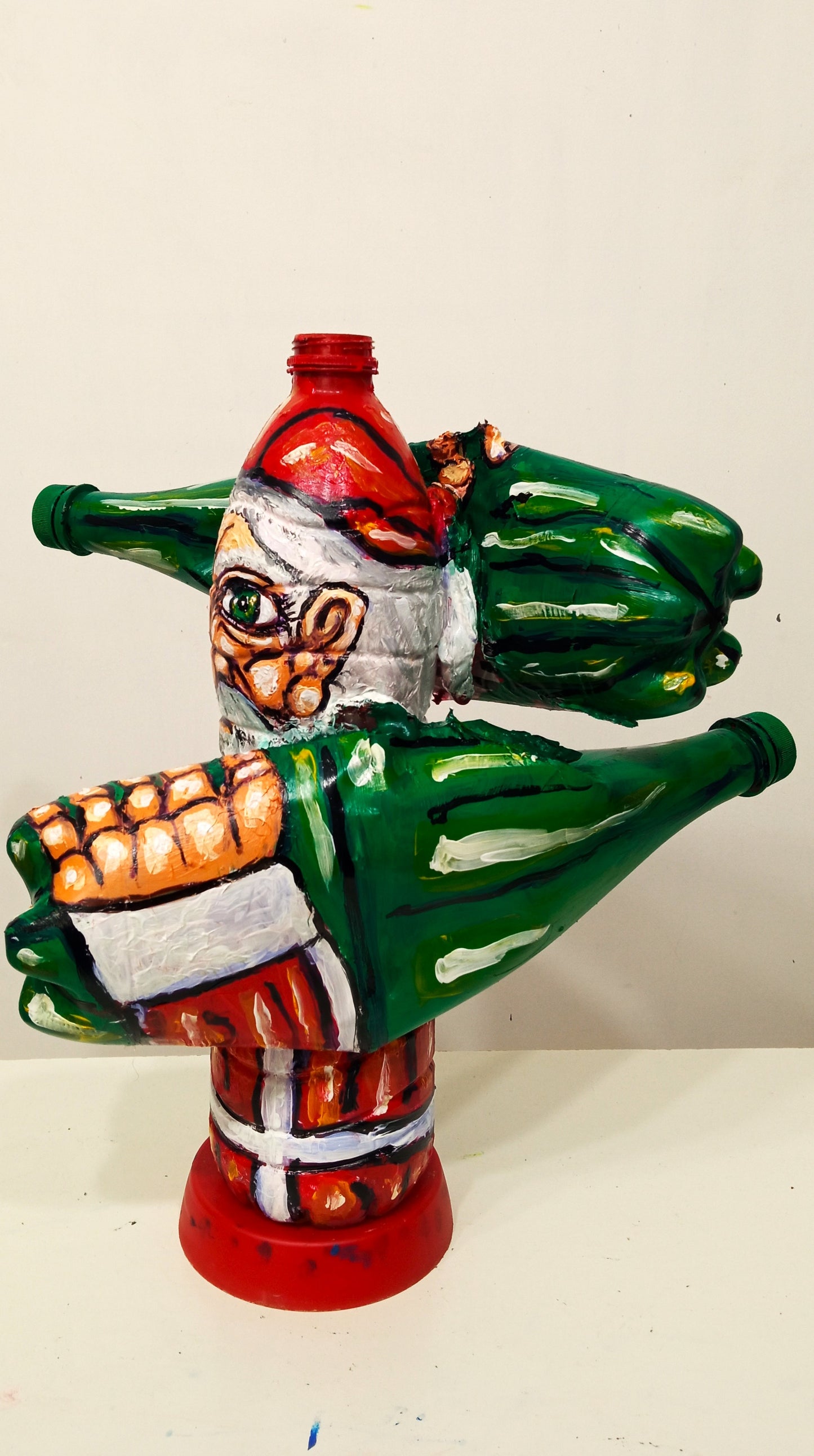 Grumpy Santa Claus Figurine Created out of Recycled Plastic Bottles . [Recycled Art]. Ivan Fyodorovich. Left lateral view