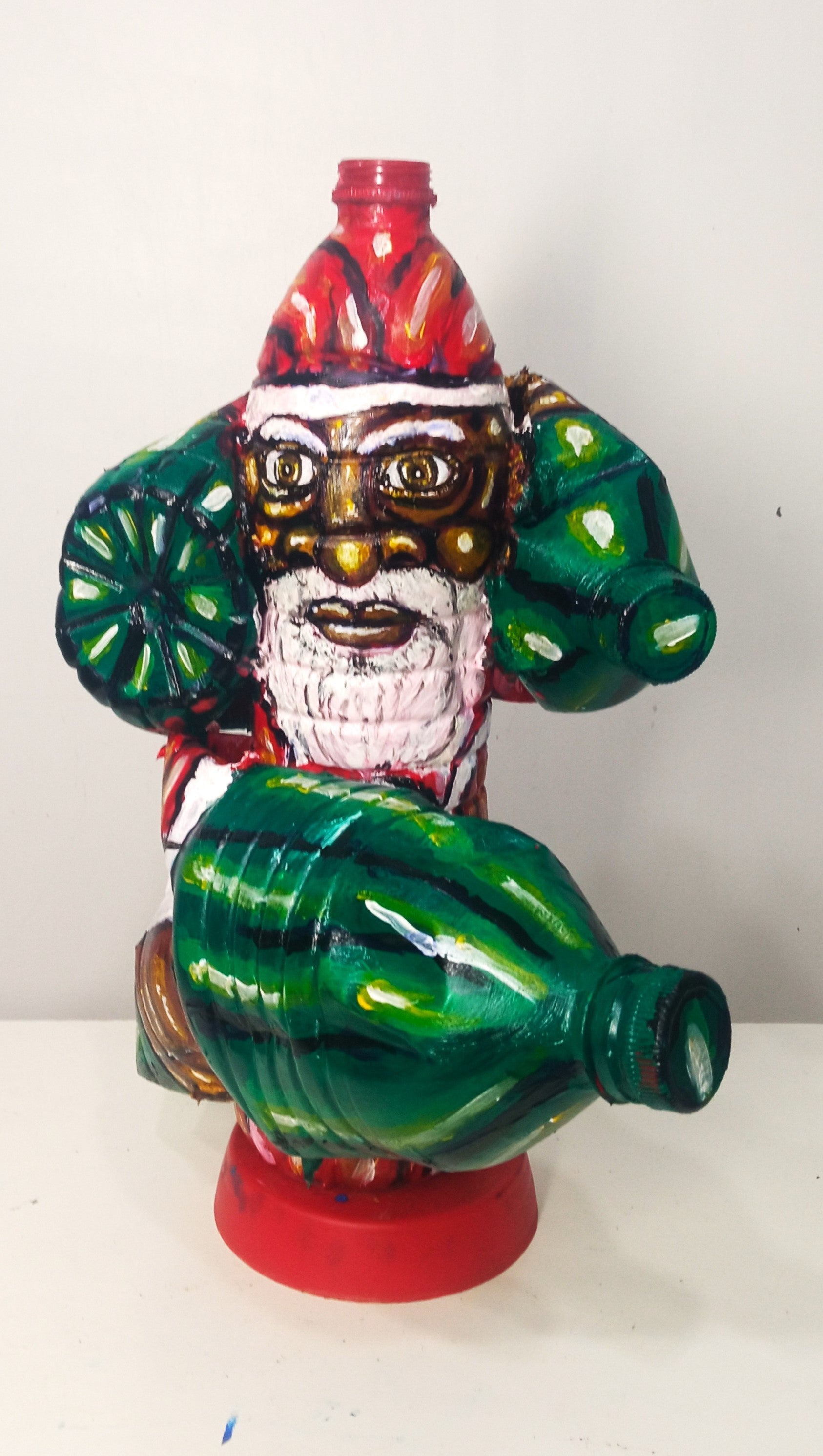 Black Santa Carrying Bottles Created out of Recycled Plastic Bottles . [Recycled Art]. Ivan Fyodorovich. Front view