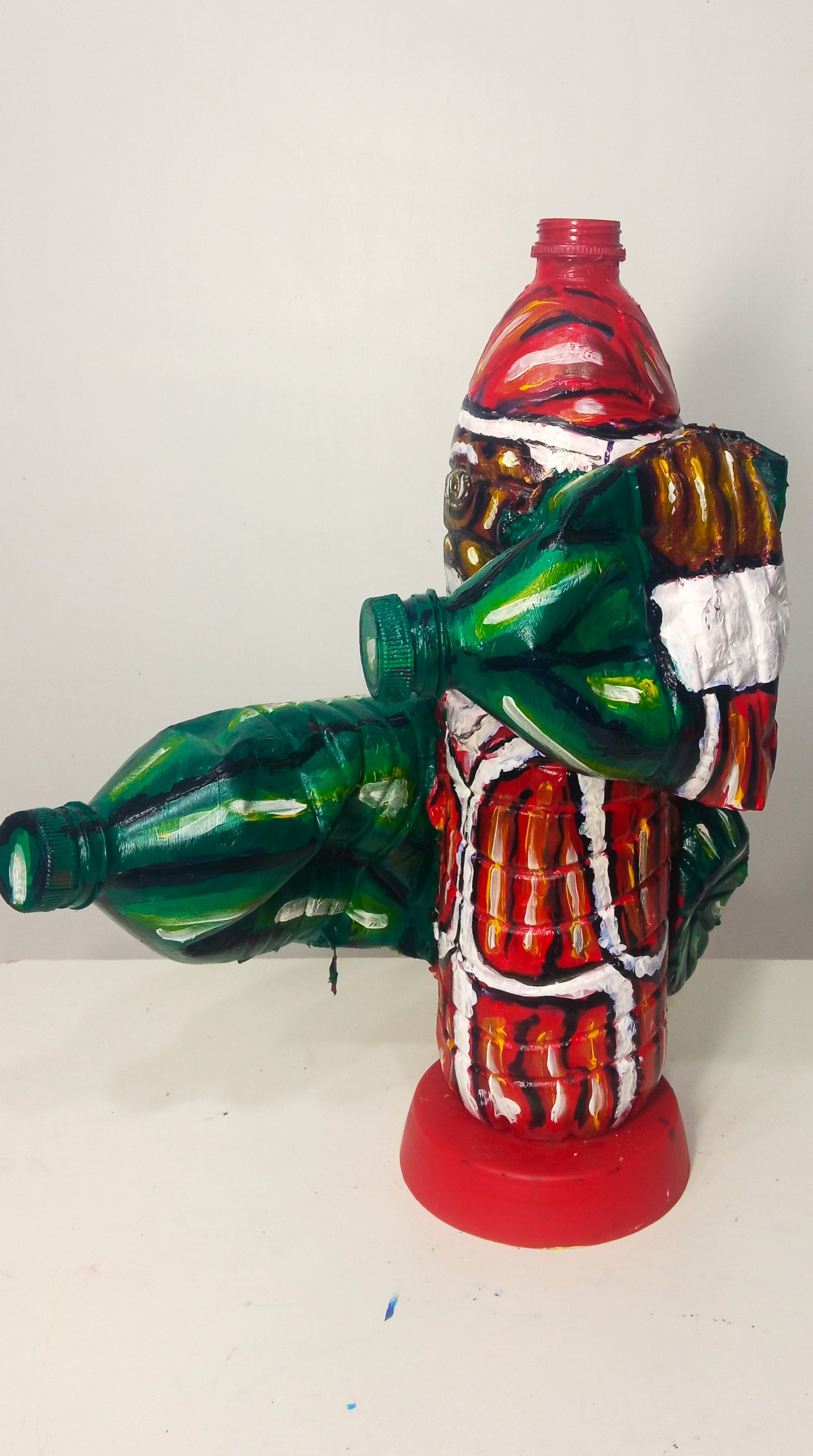 Black Santa Carrying Bottles Created out of Recycled Plastic Bottles . [Recycled Art]. Ivan Fyodorovichright lateral view