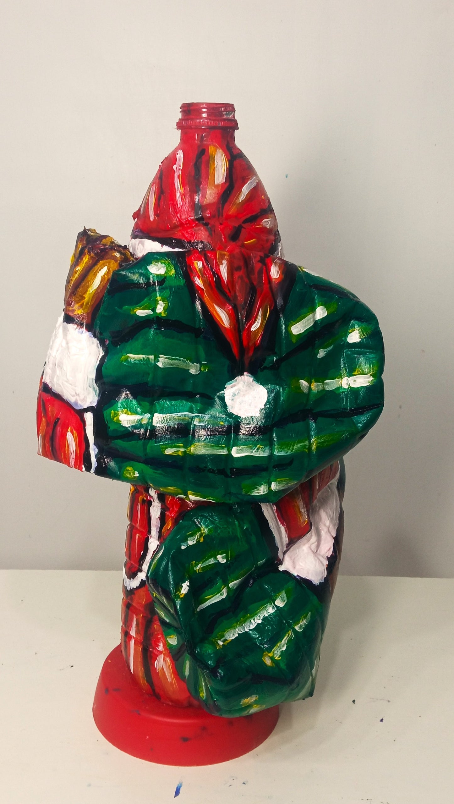 Black Santa Carrying Bottles Created out of Recycled Plastic Bottles . [Recycled Art]. Ivan Fyodorovich. Back side view