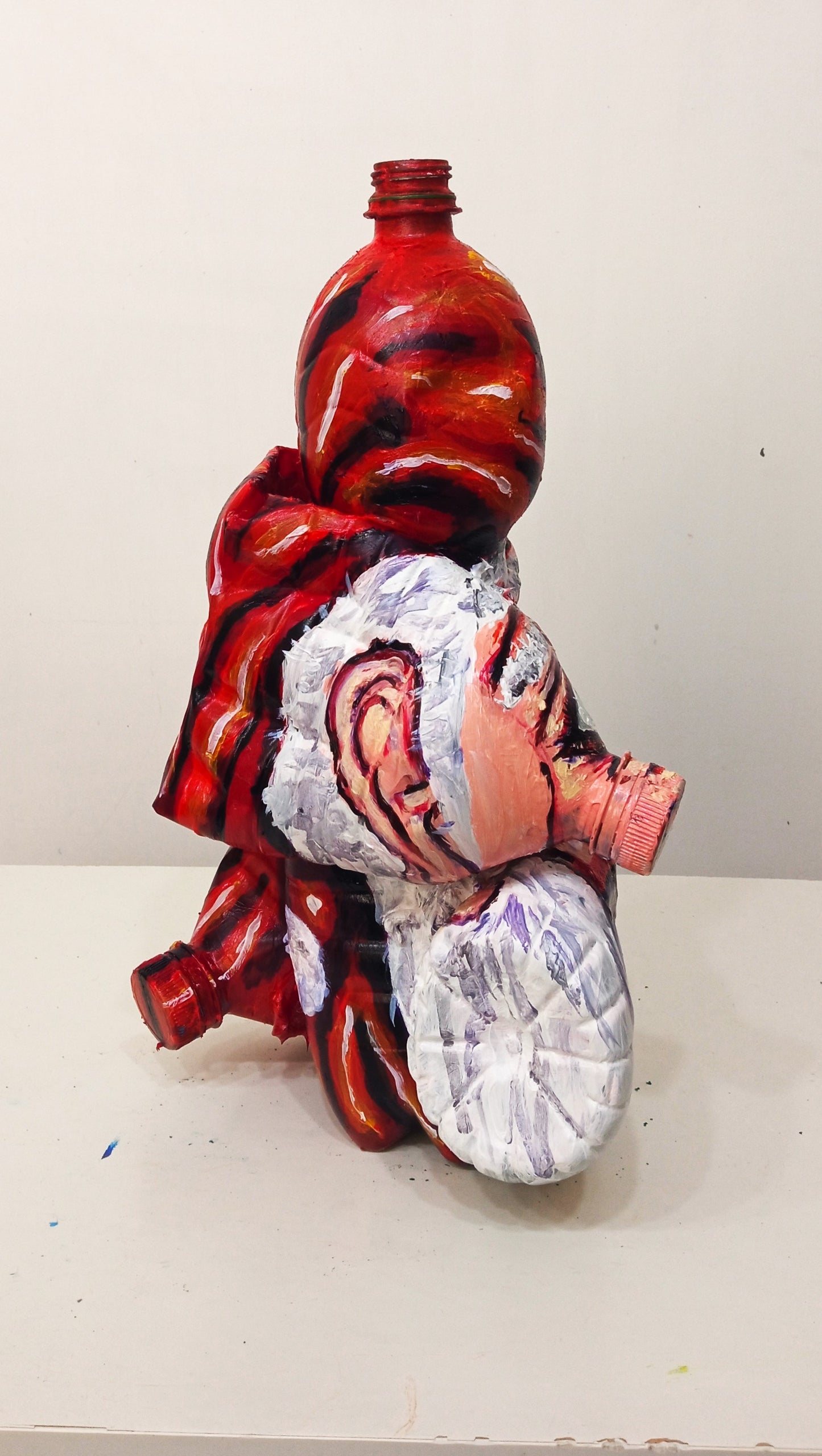 Distorted Faced Santa Claus Created out of Recycled Plastic Bottles . [Recycled Art]. Ivan Fyodorovich.Left lateral side