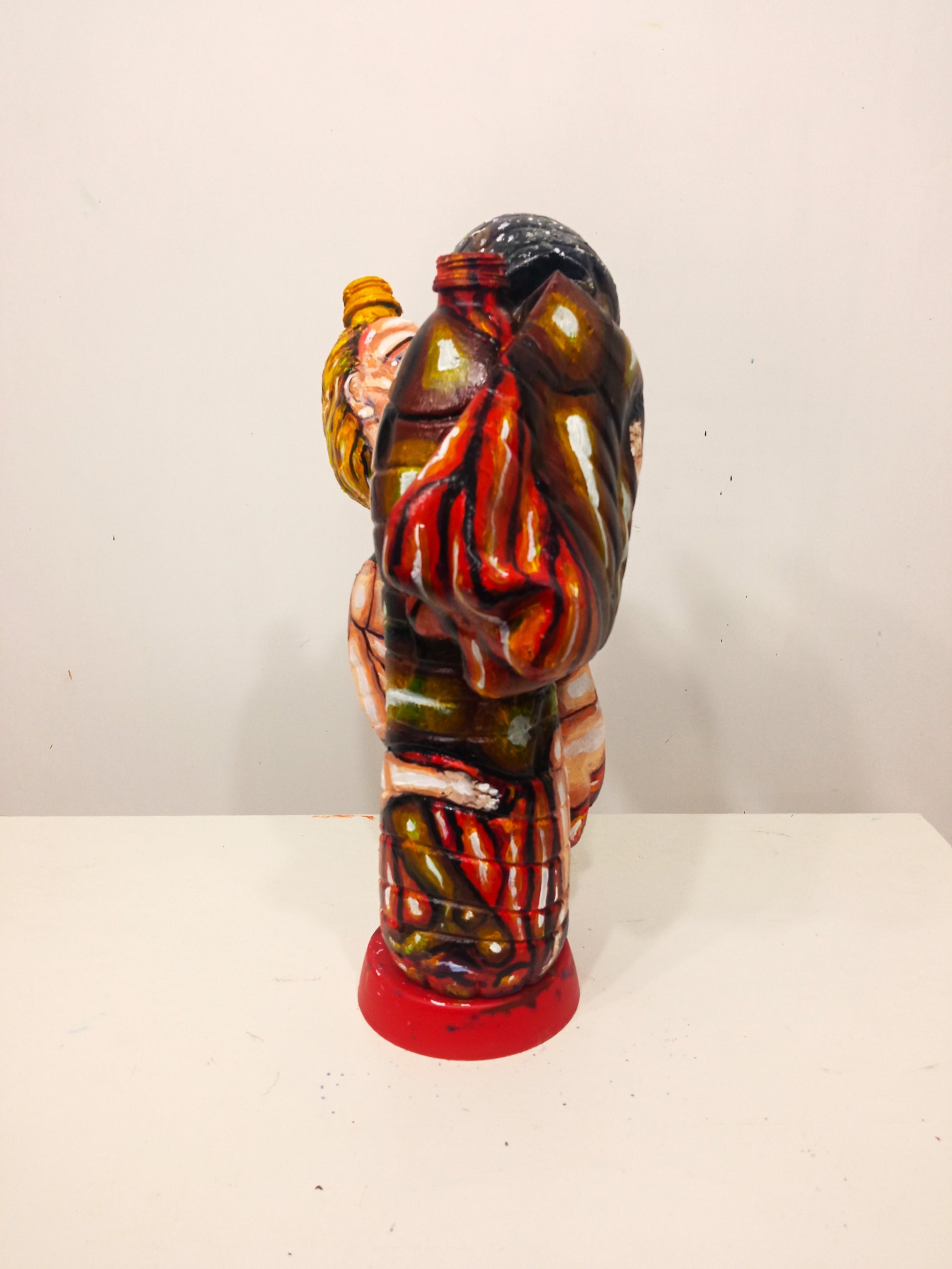 Mixed Race Couple Kissing Figurine Made out of Recycled Plastic Bottles.[Recycled Art]. front view