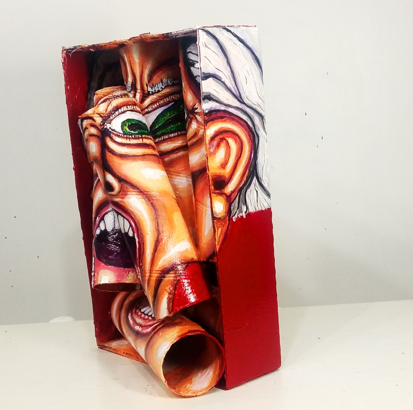 3D Portrait of a Man full of hatred. Acrylic on Recycled cardboard Tubes.  [Recycled Art]. Medium right lateral view