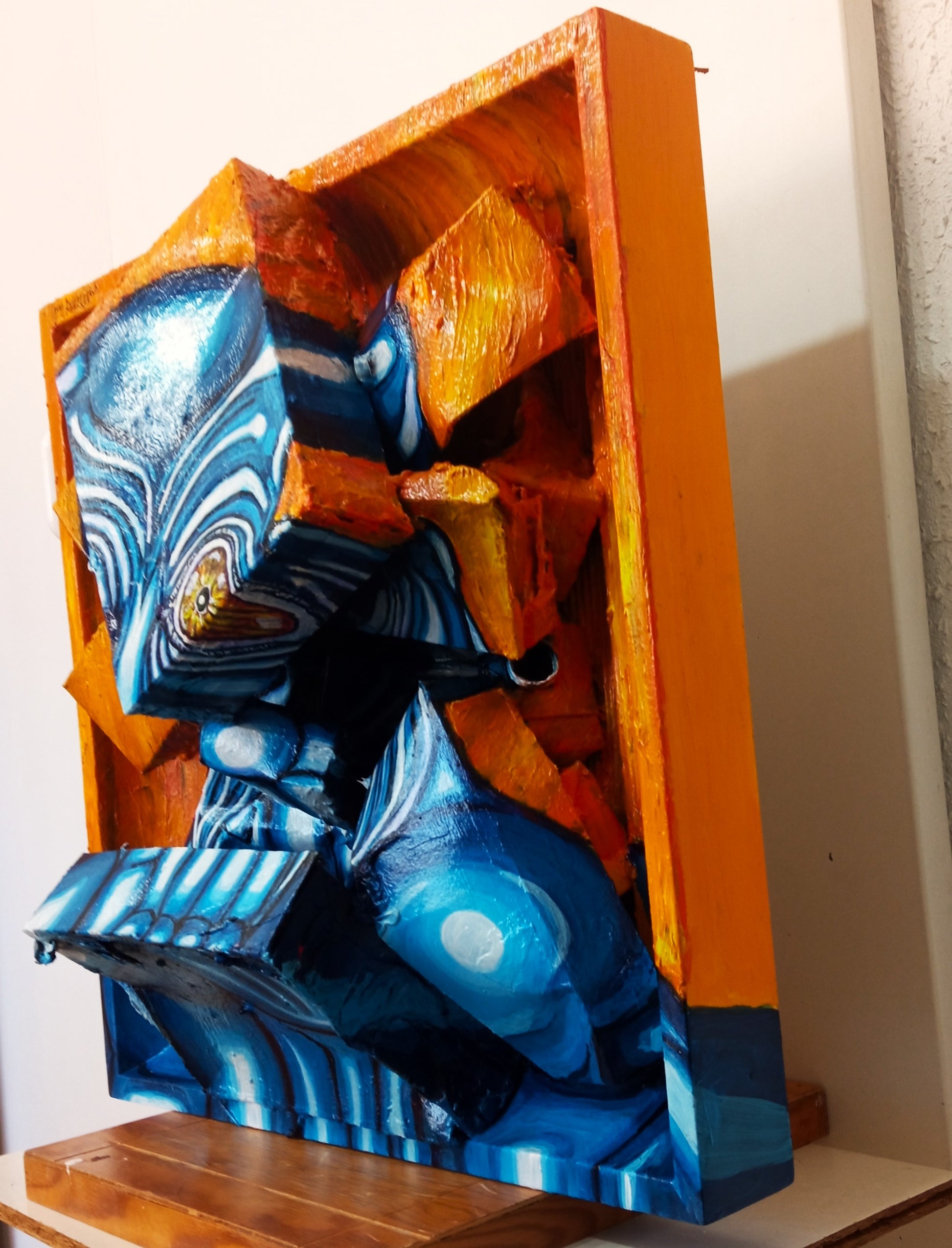 3D Portrait of a Lonely Blue Man. Acrylic on Woodboard and Recycled Cardboard Boxes. (Mental Health Issues Art) [Recycled Art]. Right lateral View