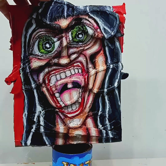 3D art streetart style painting portrait of a screaming woman. Acrylic on recycled cardboard and four pairs of recycled 3D cinema glasses. [Recycled Art]. Vide