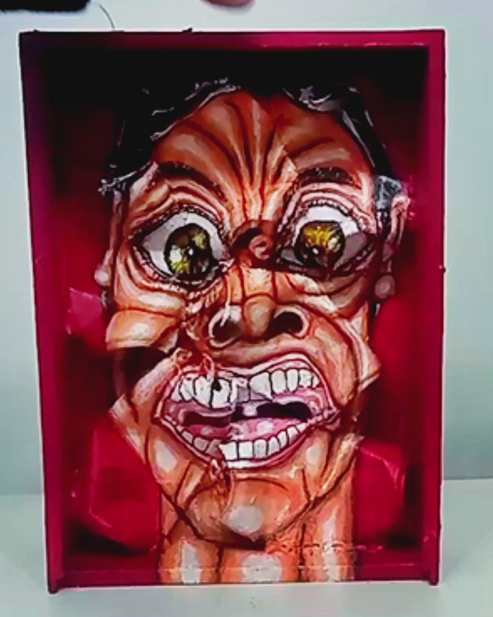 3D Streetart expressionistic style portrait painting.Anguished man with panic attack portrait. Acrylic on Wood box and Recycled beer Cans. [Recycled Art]. Video